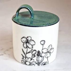 Porcelain lidded jar with floral print and glazed lid