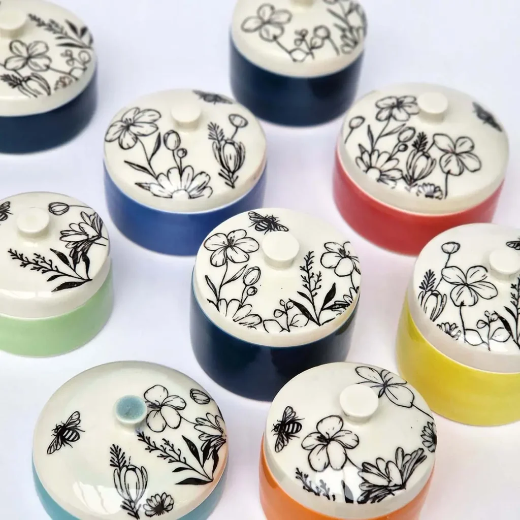 porcelain colourful lidded boxes with floral prints on the lid