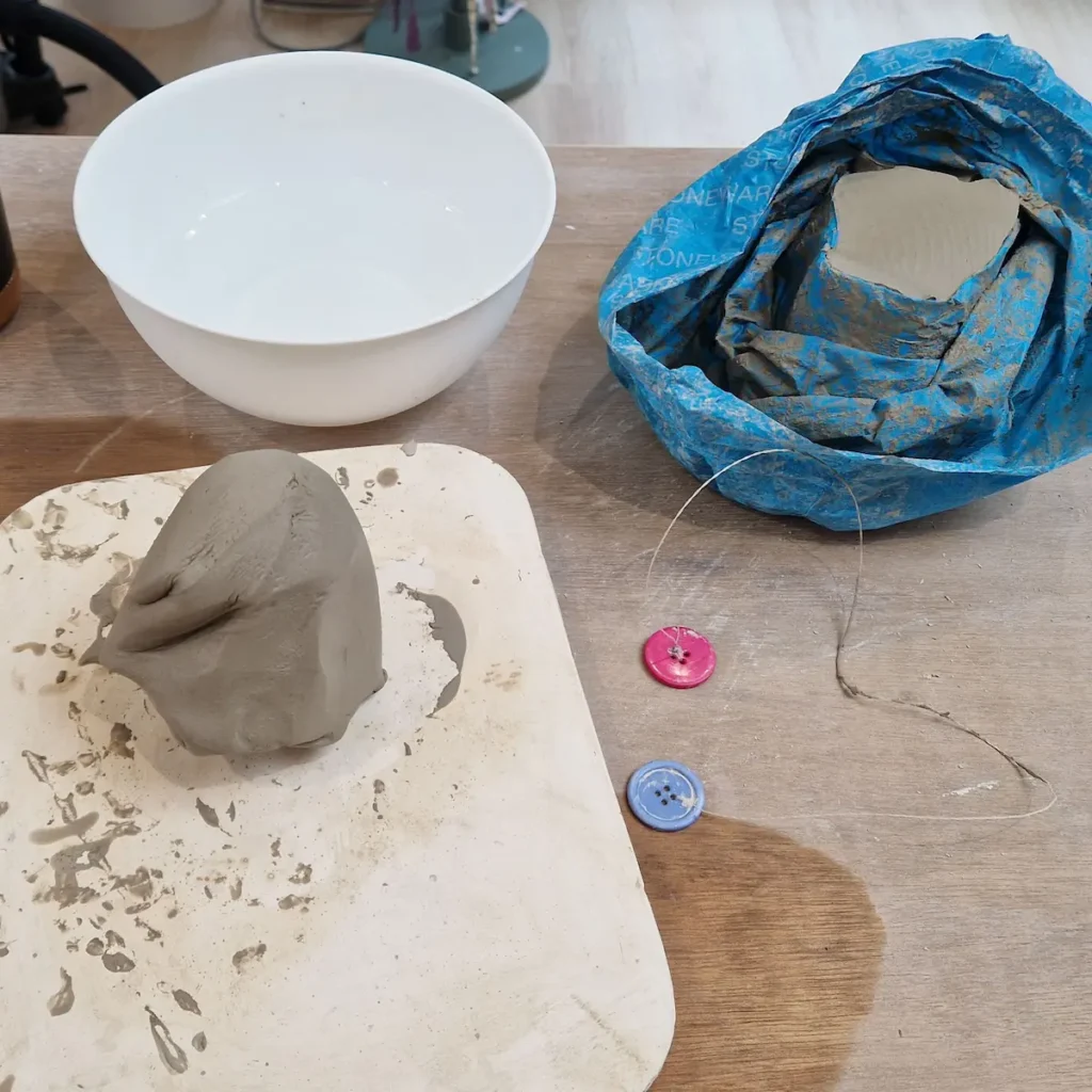 A hand-wedged lump of raw clay getting ready for the throwing journey on the potter's wheel in a South Ealing studio.